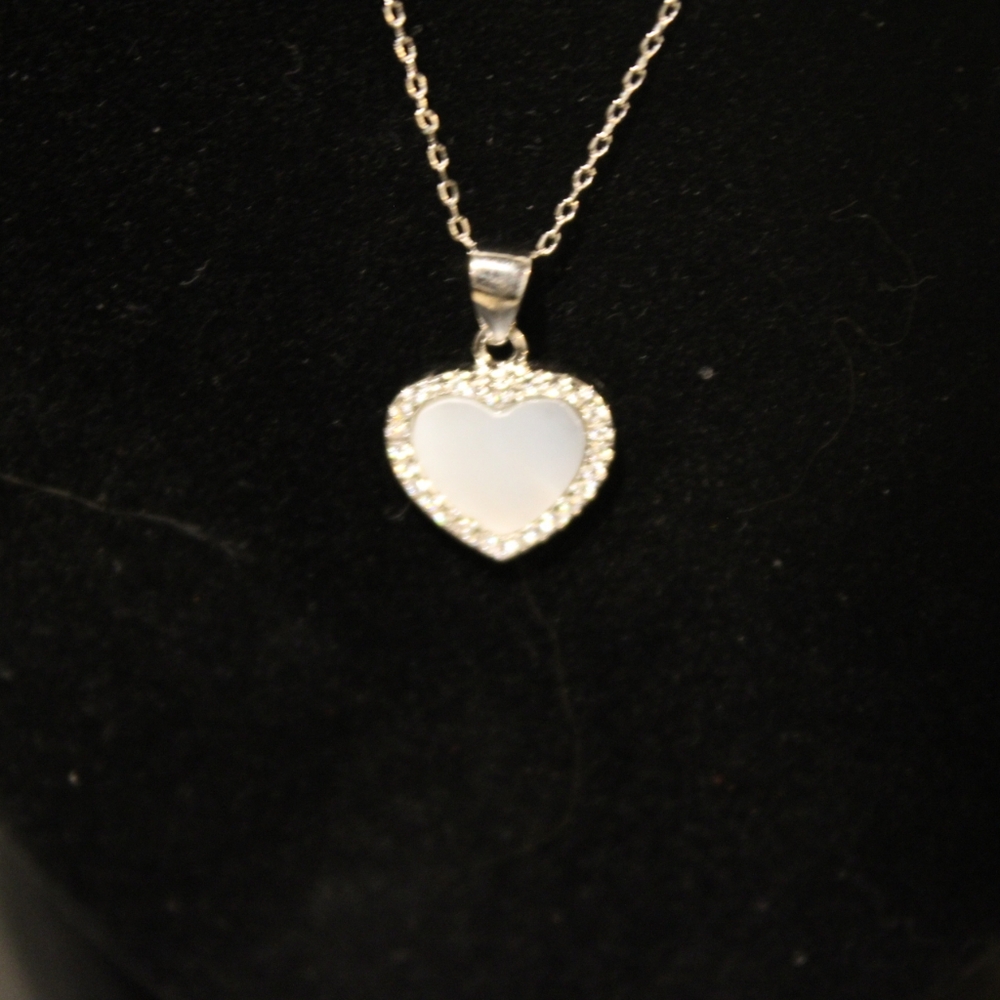 Brand new silver, zirconia halo heart necklace